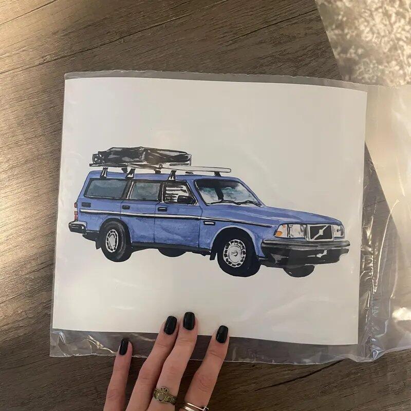 PaintMySoul customer holding a custom car portrait